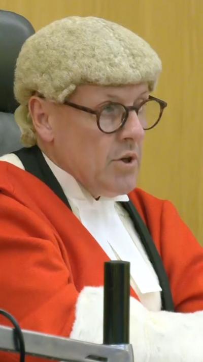 Judge Mr Justice Hilliard in court 