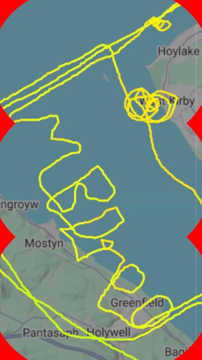 Bored spelt out in green letters on flight tracking app flightradar24 over a mape of North Wales
