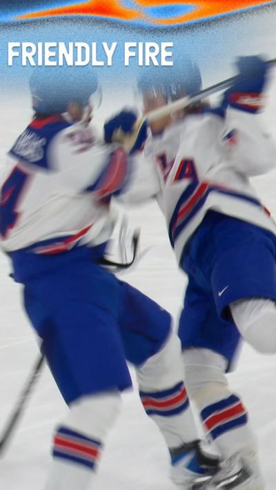 Auston Matthews and Jack Hughes crash into each other in the USA’s ice hockey match against Germany