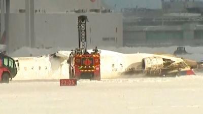 Damaged plane on a runway 