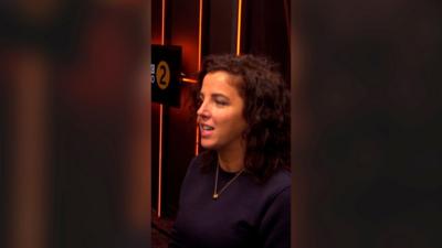 Jamie-Lee O'Donnell wearing a black top in a BBC radio studio.