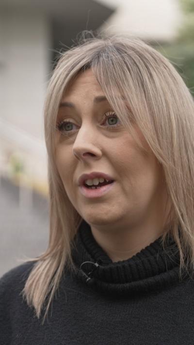 Aimee Coombes, who has blonde hair and is wearing a black jumper