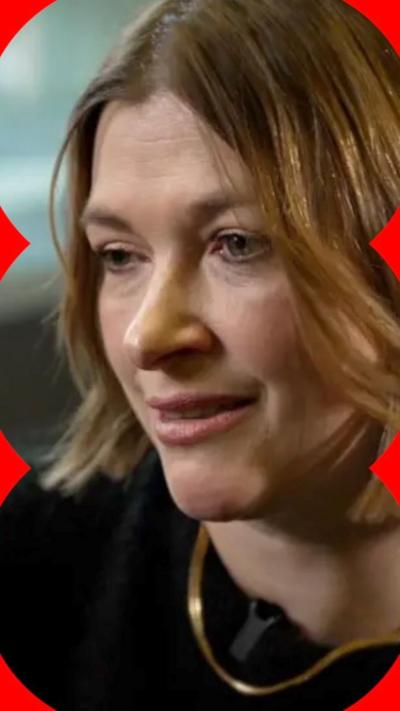 A close range photo of a woman, Nicki Guy, with a brown bob and black top.