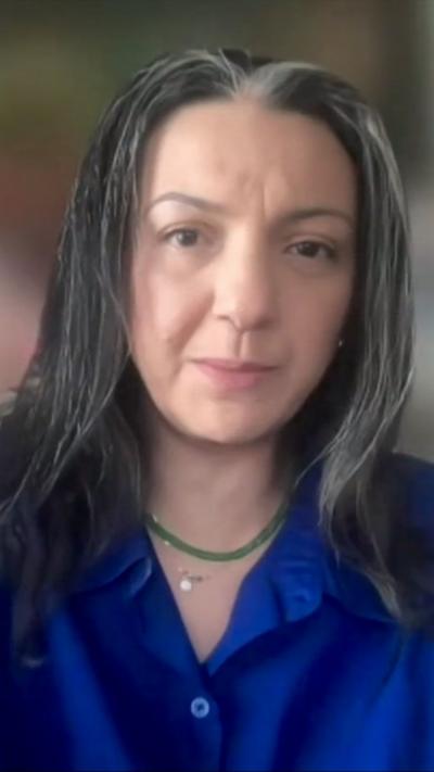 Shaimaa Khalil wearing a blue shirt