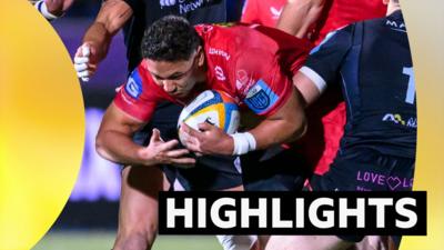 Dan Davis of Scarlets is tackled by Tom Jordan of Glasgow Warriors