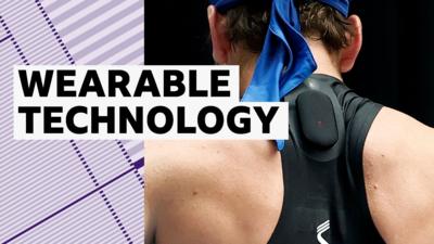 A tennis players wears a small black device on his back 
