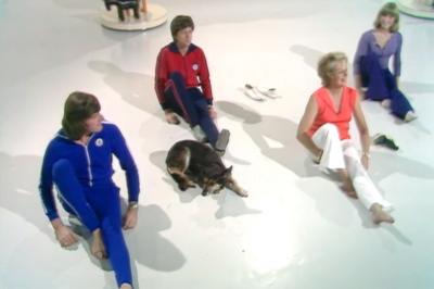 John Noakes, Peter Purves and Lesley Judd do an exercise on the floor with Eileen Fowler