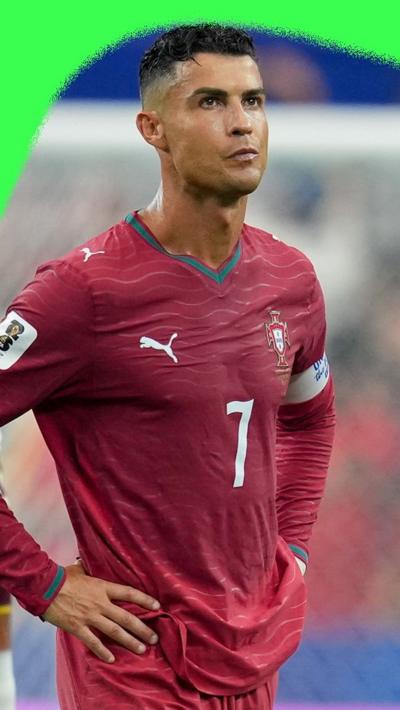 Cristiano Ronaldo. He is wearing a Portugal home shirt.