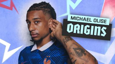 Michael Olise poses