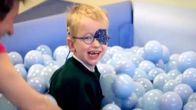 Boy in ball pit