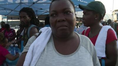 A woman who survived Hurricane Dorian arrives in Nassau