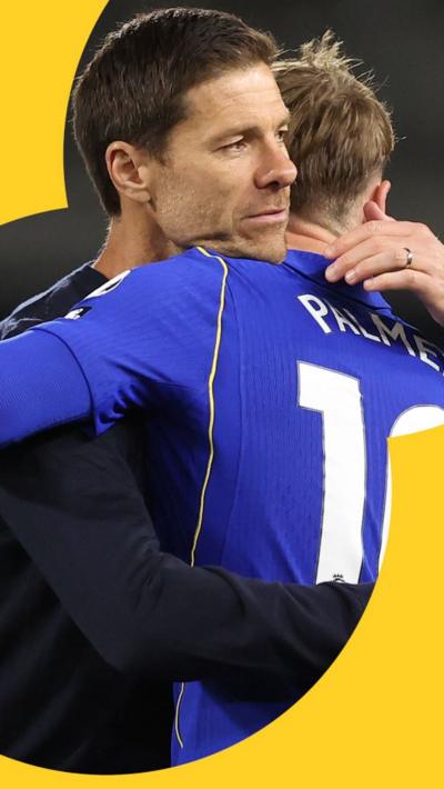 Xabi Alonso hugs Cole Palmer 