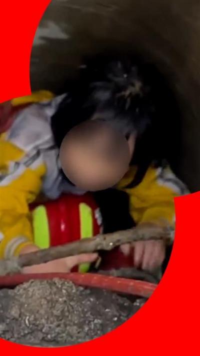 Moment firefighters rescue girl trapped in drain for seven hours