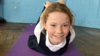 Child doing yoga