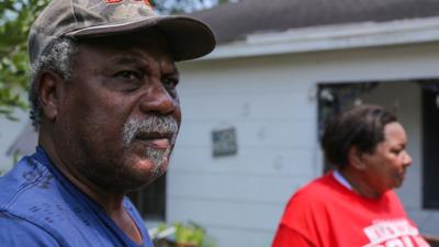 Families return home for the first time after flooding destroyed their houses.