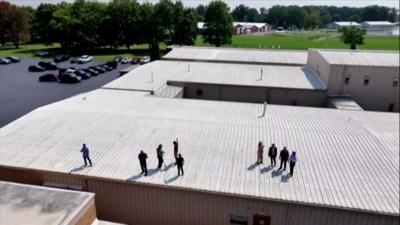 Task force surveying the roof top where shooter was positioned 