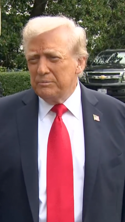 Donald Trump talking to reporters before flying to the UK