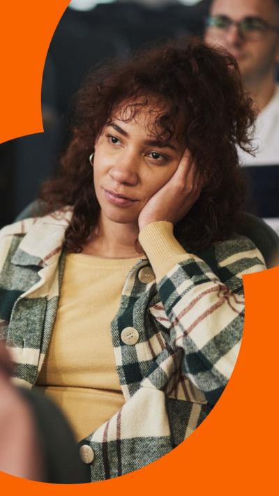 Woman with her head resting in her hand 