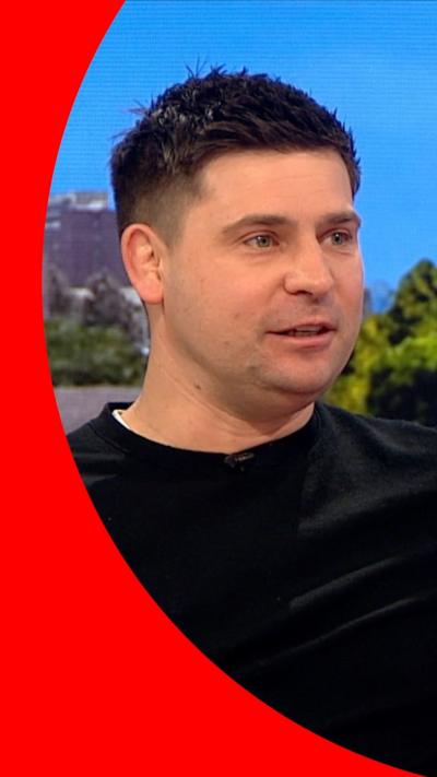 Ben Youngs wears a black pullover whilst sitting in the BBC Breakfast studio