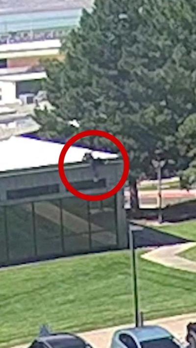 Suspect climbs off the roof