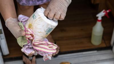 Person wipes toilet paper with cloth