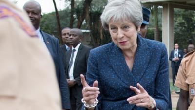 Prime Minister Theresa May breaking into dance whilst meeting with scouts at the United Nations offices in Nairobi on the third day of her visit to Africa.