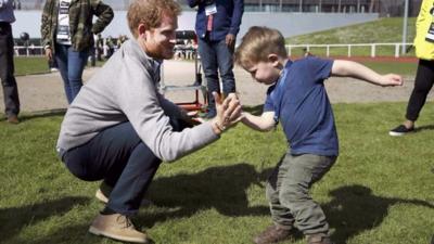 Prince Harry spars with little boy