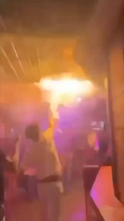 Man tries to put out flame in Swiss bar 