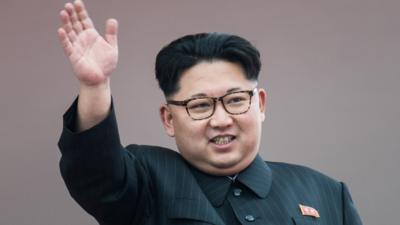 North Korean leader Kim Jong-Un waves from a balcony following a mass parade marking the end of the Party Congress on 10 May, 2016.