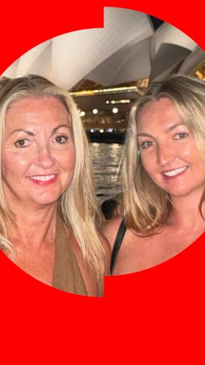 Two woman with blonde hair standing in front of Sydney Opera House