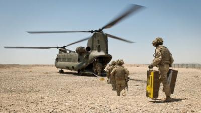 Soldiers of 4 SCOTS Bn board a British CH-47 helicopter on 10 May 2014, the final morning of the British occupation of PB Sterga 2, as they prepare to leave the base for the final time.