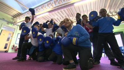 Nicola Adams surprises school boxing club