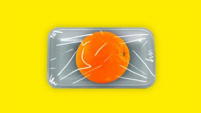 Orange wrapped in plastic