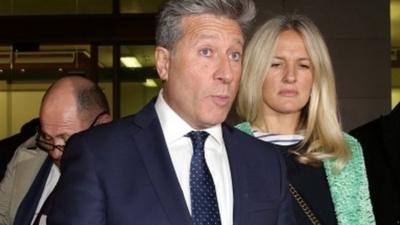 Neil Fox, with his wife, giving a statement outside Westminster Magistrates' Court