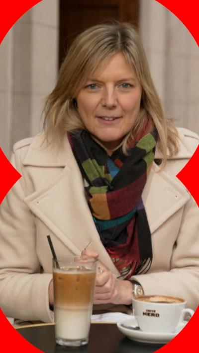 BBC correspondent Ellie Price sat with an iced drink and a mug 