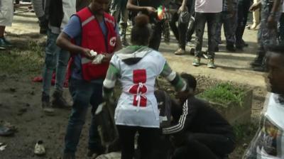 Medics attend to an injured person