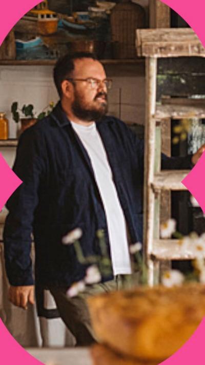 Banjo Beale looking to the side holding a ladder.