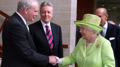 Deputy First Minister Martin McGuinness meets and shakes hands with Queen Elizabeth II.