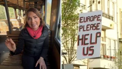 The BBC's Europe Editor Katya Adler in a split screen with a sign that says "EUROPE, PLEASE HELP US".