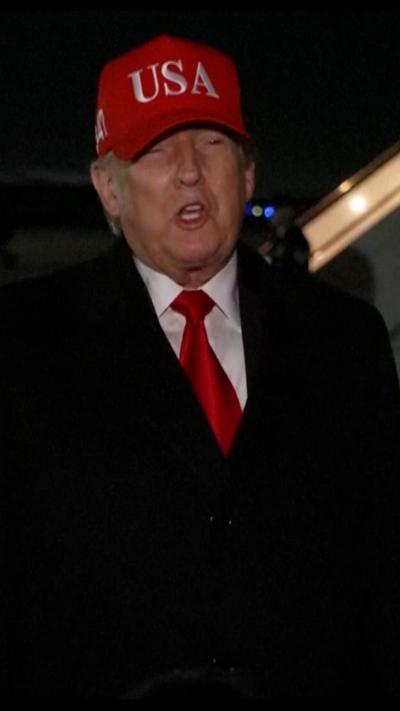 Donald Trump wearing a red cap. 