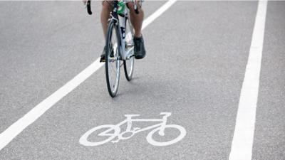 Cycling commuter in bike lane