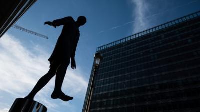 Sculpture of man outside EU council buildings