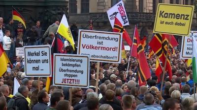 Protesters with flags and banners