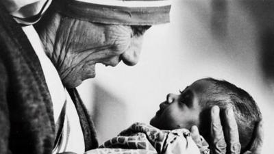 Mother Teresa holding baby