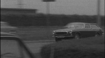 Image of a car speeding on a road