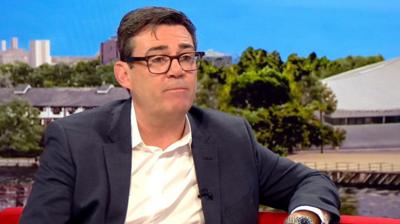 Andy Burnham wearing white shirt and black blazer