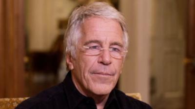 Jeffery Epstein in a black shirt and glasses