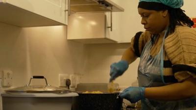 Chantelle Bent preparing meals in the community kitchen