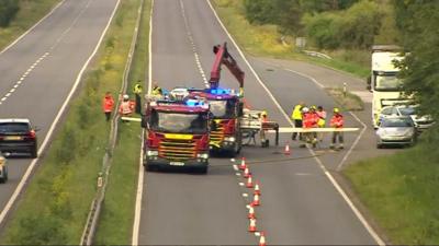 A fire engine in the middle of a road