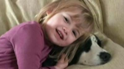 Two year old Faye Burdett with her pet dog